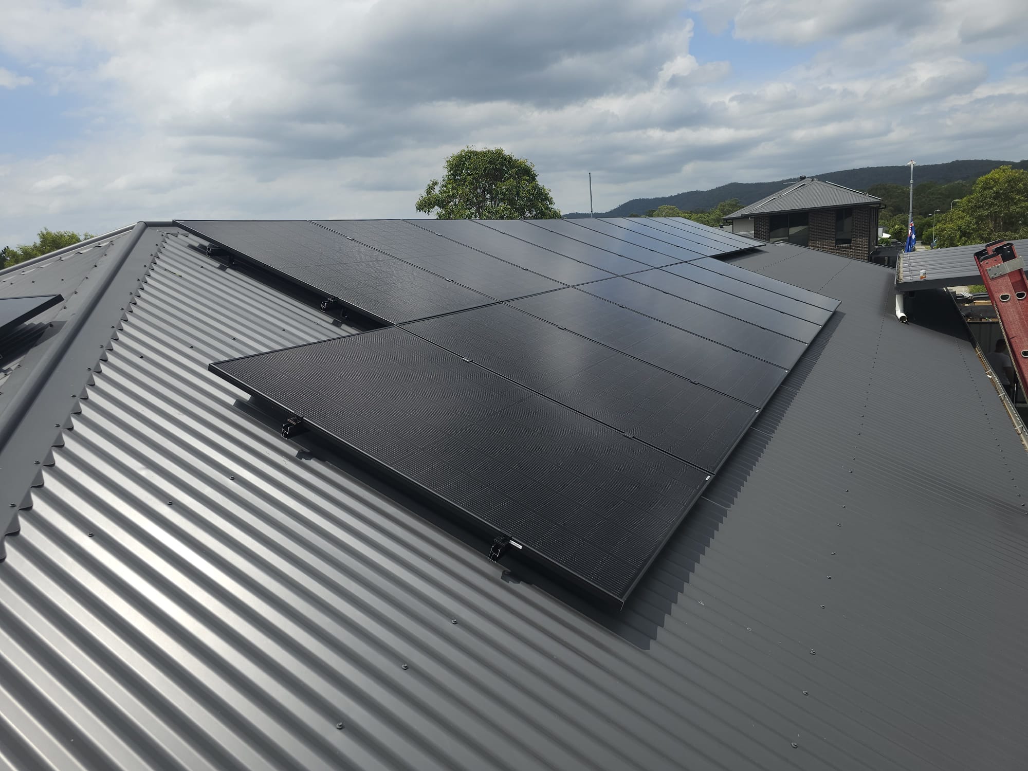 All-black solar panels on corrugated roof, Queensland install by Source Energy Group